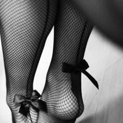 Feet in fishnet stockings